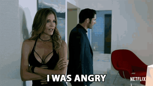 a man and a woman standing next to each other and the woman says i was angry