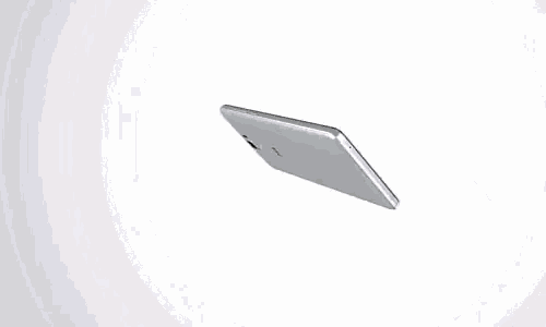 the back of a white cell phone with a camera on it