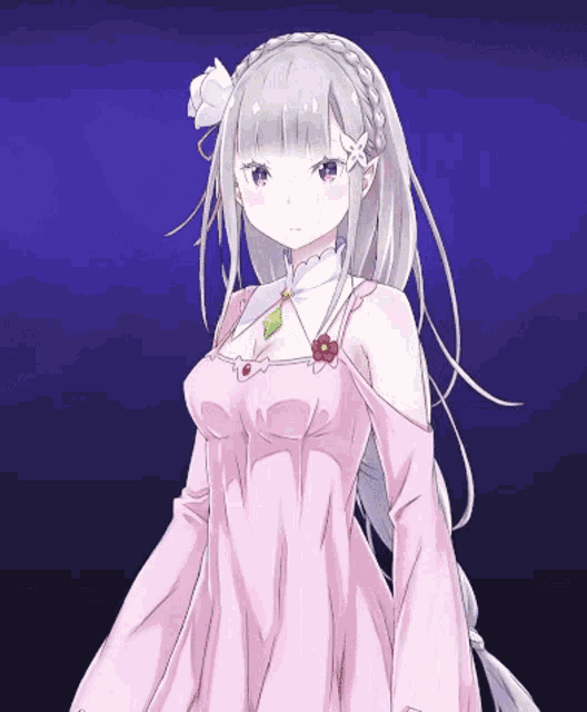 a girl in a pink dress with a flower on her head