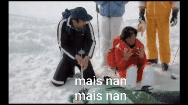a man is kneeling down in the snow with the words mais nan mais nan written on the bottom