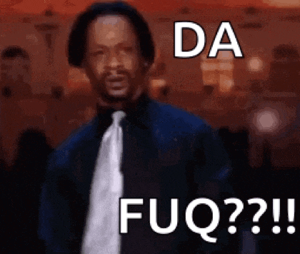 a man in a suit and tie is standing in front of a sign that says `` da fuq ? ''