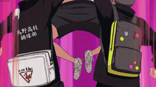 a couple of people standing next to each other with a backpack that says uco kbei on it .