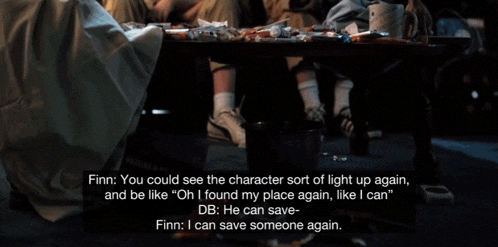 two ghostbusters sit on a couch talking to each other with finn saying " you could see the character sort of light up again "