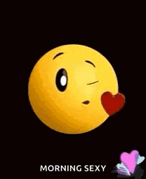 a yellow smiley face is blowing a kiss with a red heart .