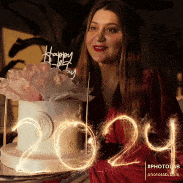 a woman in a red dress is holding a cake with the number 2024 written in sparklers