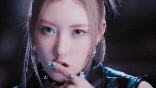 a close up of a woman smoking a cigarette