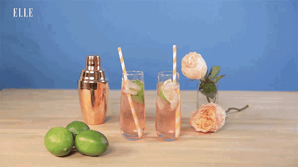 two people toasting with drinks with the word cheers on the bottom