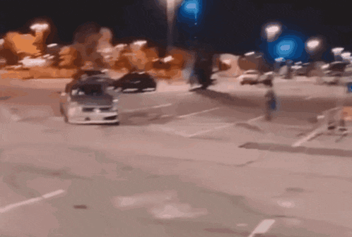 a car is driving down a street with a white line on the side