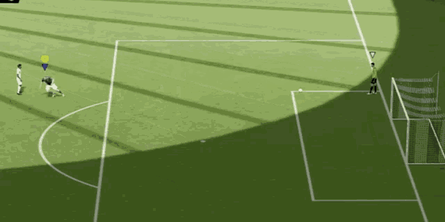 a soccer game is being played on a green field with a yellow triangle on the corner