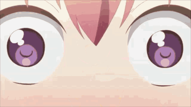 a close up of a girl 's eyes with a purple circle in the middle .