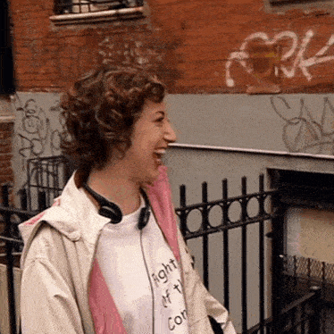 a woman wearing headphones and a t-shirt that says fight it