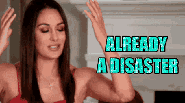 a woman with her hands in the air and the words already a disaster