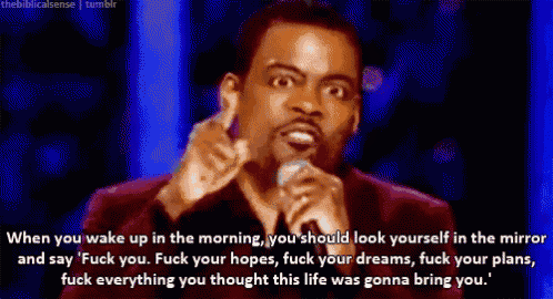 a man speaking into a microphone with a quote from the biblical sense