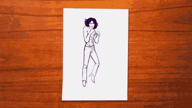 a drawing of a woman in a trench coat is on a wooden table