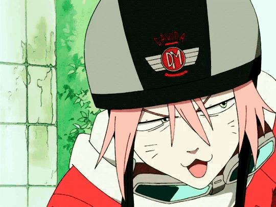 a girl with pink hair wearing a helmet with the letter dm on it