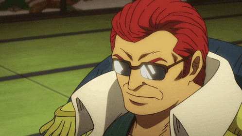 a man with red hair and sunglasses is wearing a white collar
