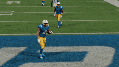 a football player with the number 15 on his jersey catches the ball