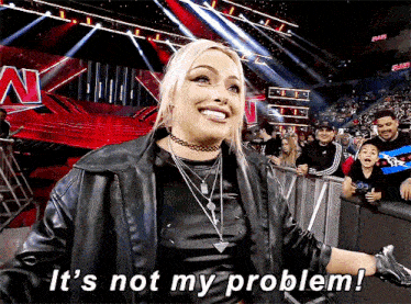 a woman stands in front of a crowd with the words it 's not my problem
