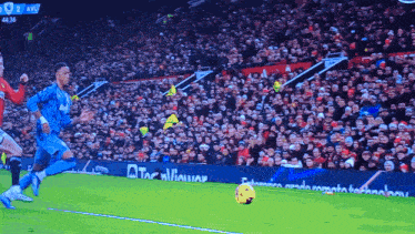 a soccer game is being played in front of a crowd with the score at 44:36