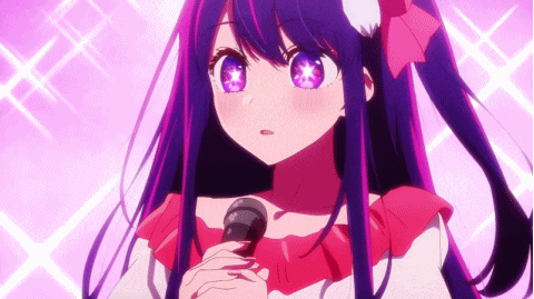 a girl with long purple hair is singing into a microphone .