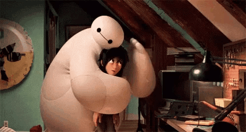 a giant stuffed animal is hugging a girl in a room .