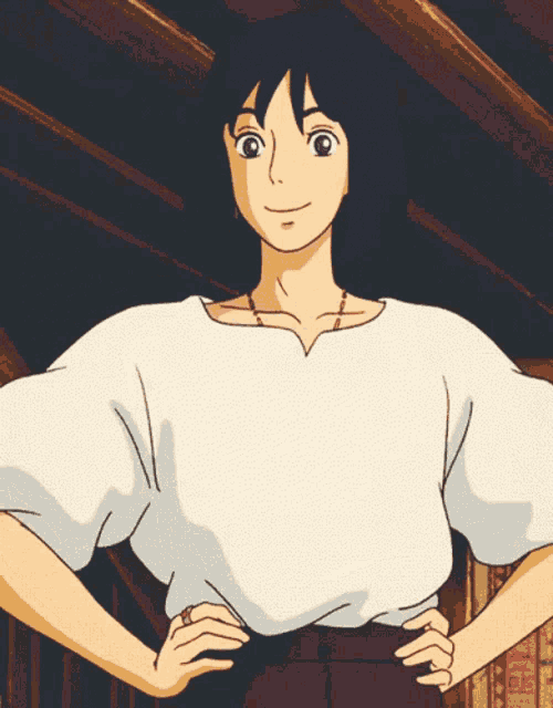 a girl in a white shirt with her hands on her hips looks at the camera