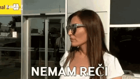 a woman wearing sunglasses says nemam reci