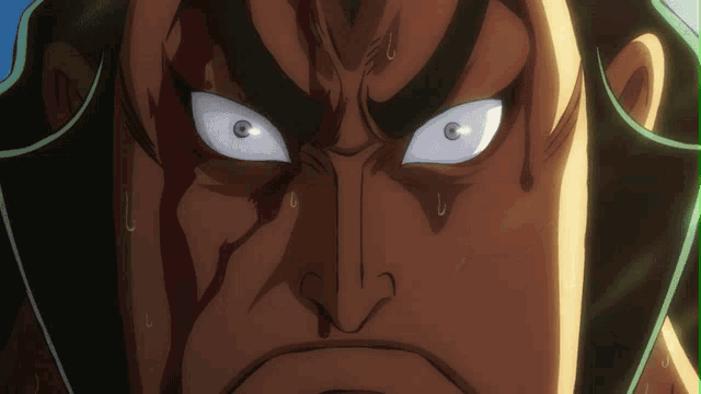 a close up of a man 's face with blood coming out of it