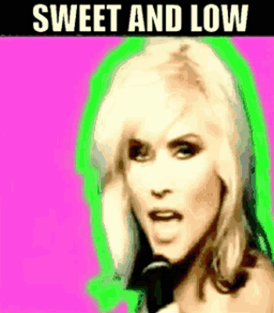 a woman singing into a microphone with the words sweet and low written below her