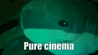 a stuffed animal with the words pure cinema written above it