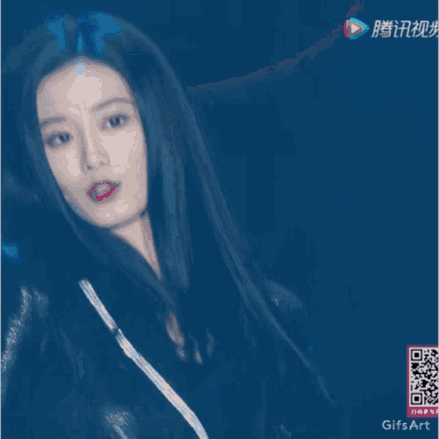 a gif of a woman with a qr code on the bottom right
