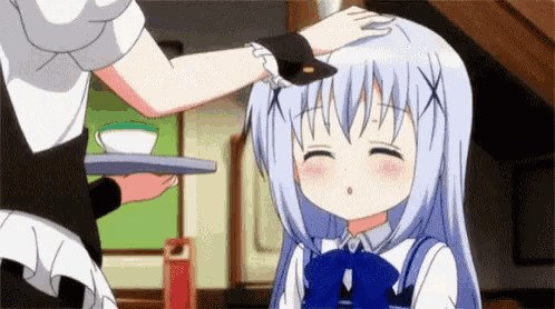 a girl is petting another girl 's head while a maid holds a tray of tea .