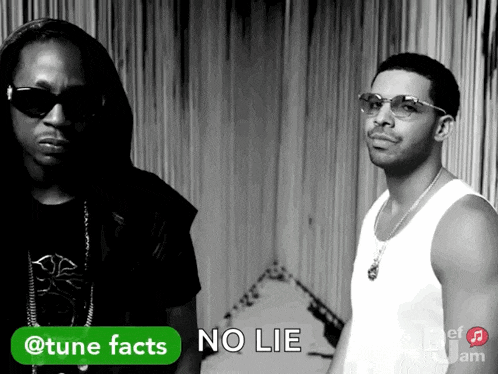 two men standing next to each other with a green button that says tune facts on it