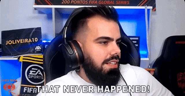 a man with a beard is wearing headphones and says that never happened