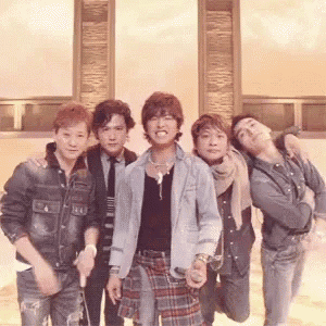 a group of young men are posing for a picture