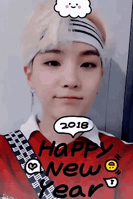 a young man is wearing a red shirt that says happy new year on it