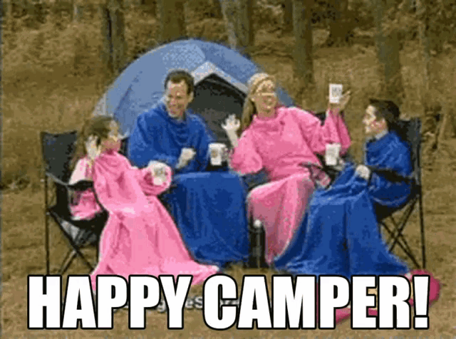 a family is sitting in front of a tent with the words happy camper written on the bottom