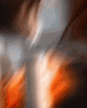 a blurry picture of a person 's torso with a few spots of orange