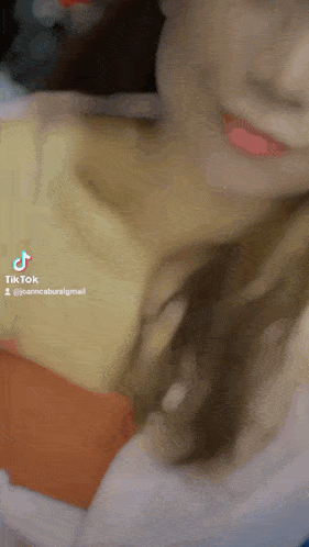 a close up of a woman 's face with a tiktok watermark on it