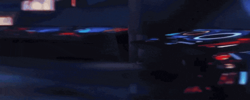 a swimming pool with a light shining on the edge