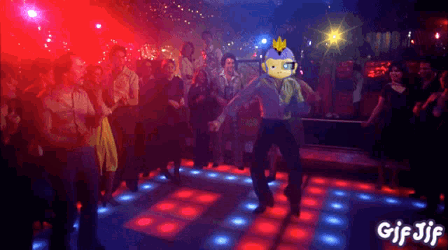 a gif of a man dancing in a club with the words gif jif below him