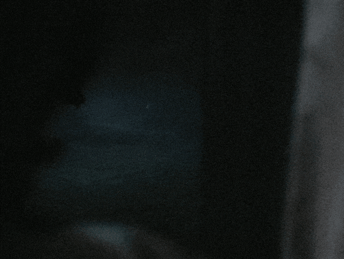 a dark background with a few white dots on it