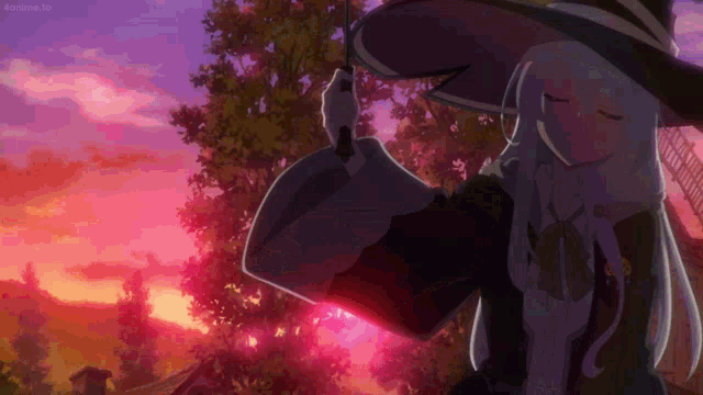 a girl in a witch hat is standing in front of a pink and purple sky