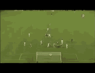 a group of soccer players are playing a game on a field