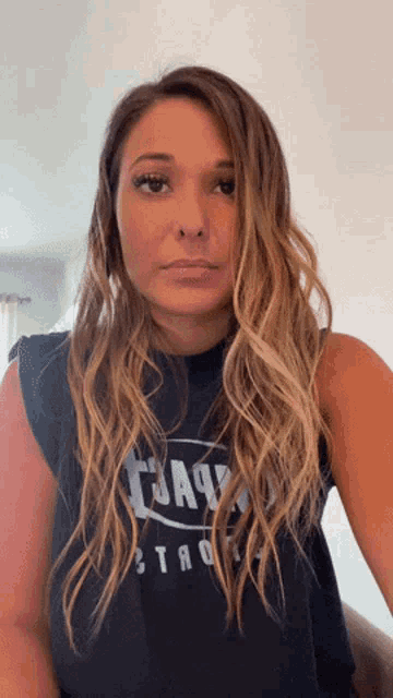a woman wearing a black t-shirt that says cjax