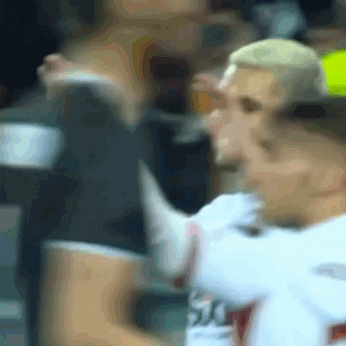 a blurry picture of a soccer player wearing a jersey with the number 30 on the back
