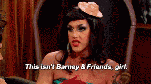 a drag queen is sitting in a chair and talking to a man while wearing a hat .