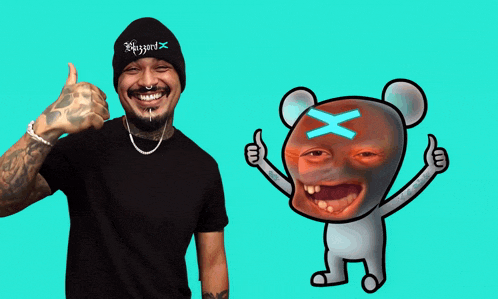 a man wearing a beanie that says blizzard giving a thumbs up next to a cartoon character
