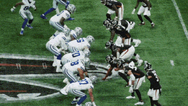 a football game is being played between the falcons and the cowboys