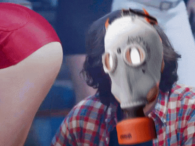 a man wearing a gas mask has the word jeep on his face